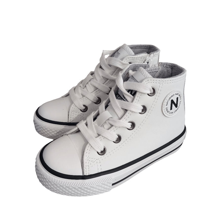 Sneakers bambino bianche in pelle con lacci, suola alta e dettagli neri a vista.