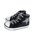 Sneaker alta bambina nera con stella glitter argentata e dettagli zebrati, punta bianca.